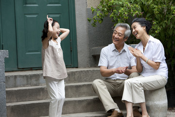 Young Chinese girl with grandparents