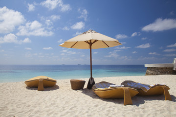 loungers on the beach in the Maldives