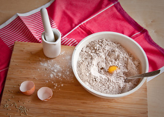 Flour in a large bowl on a cutting board