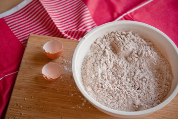 Flour in a large bowl on a cutting board