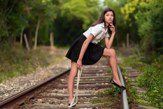 Beautiful woman on the railway line