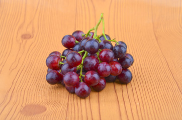 Fresh grape on wooden table.