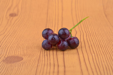 Fresh grape on wooden table.