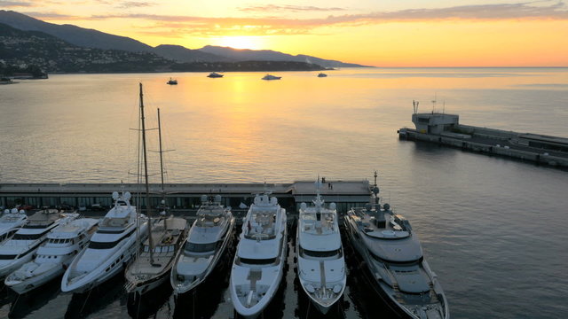 Aerial Monte Carlo sunrise Mediterranean Pier luxury yacht