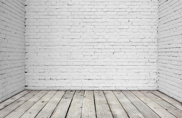 White brick wall and wood floor.