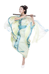 Young woman in Chinese traditional costume blowing Chinese flute © Blue Jean Images