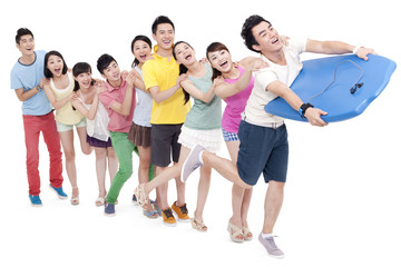 Fototapeta premium Young people imitating surfing in a row