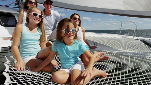 Smiling Caucasian Family Female Siblings Ocean Yacht Freedom Living Investment