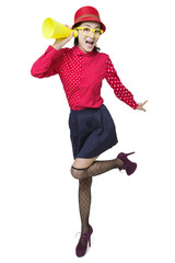 Young woman listening through megaphone 