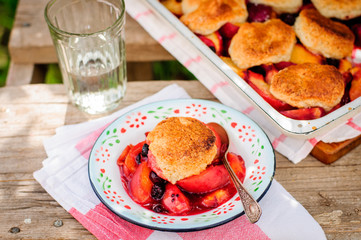 A Portion of Peach and Black Raspberry Cobbler