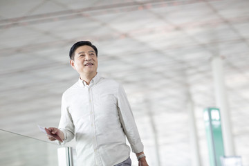 Mature man waiting at airport