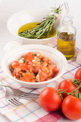 tomato salad with onion, garlic, rosemary and olive oil