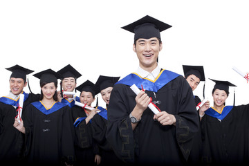 Portrait of graduates holding diploma 