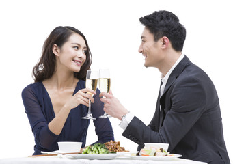 Happy young couple toasting champagne flutes