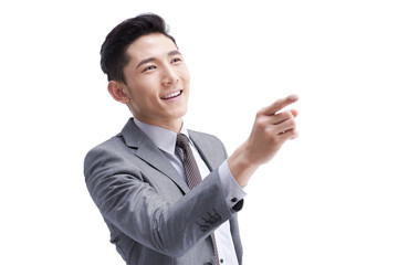 Young businessman pointing away