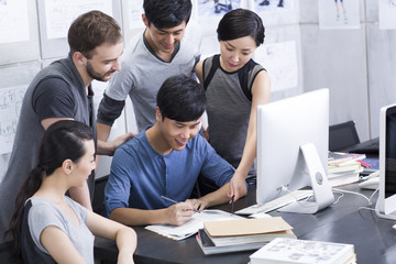 Young adults working in office