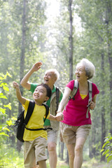 Fototapeta premium Little boy with his grandparents hiking