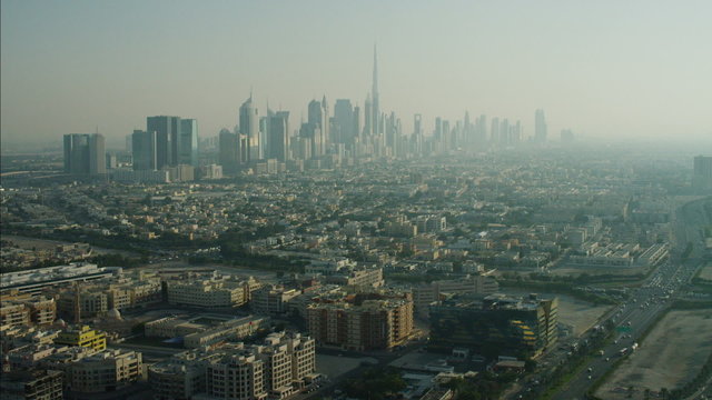 Aerial city skyscrapers suburban residential districts UAE