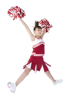 Cheerleader in action with her pom-poms