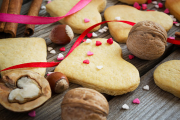 Fototapeta na wymiar Valentine cookies on a background of colorful sweet hearts, ribb