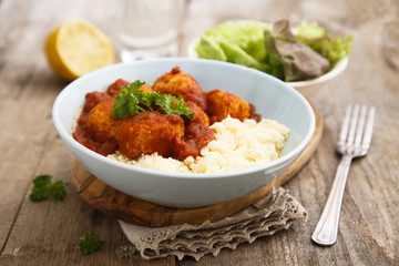 Chicken meatballs with tikka sauce and couscous