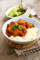 Chicken meatballs with tikka sauce and couscous