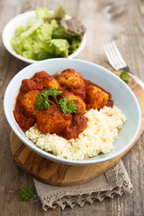 Chicken meatballs with tikka sauce and couscous
