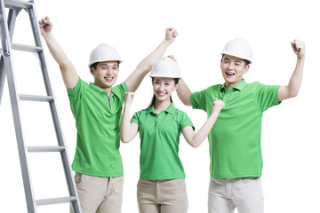 Happy volunteers punching the air