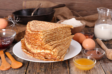 crepe with ingredient on wood background