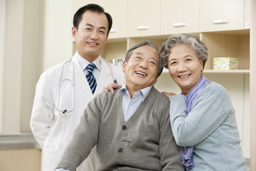 Senior Couple in an Examination Room with a Doctor