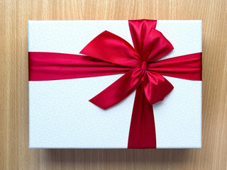 Gift box on wooden table