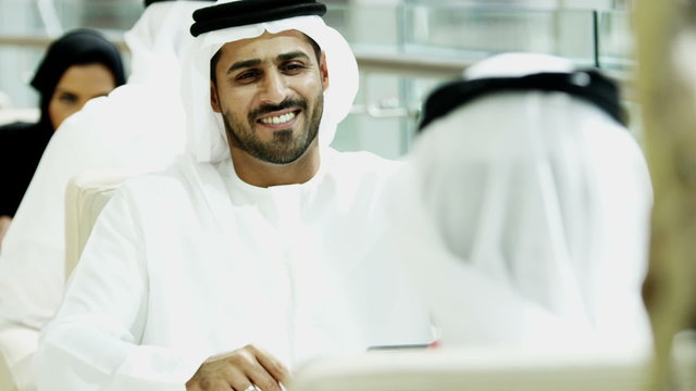 Arabic male female business colleague Gulf Region city insurance economy export