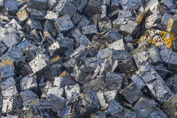 Close up of a pile of crushed cars