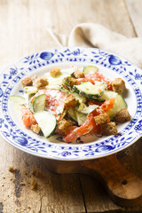 Salad with smoked salmon, rye bread and cucumber