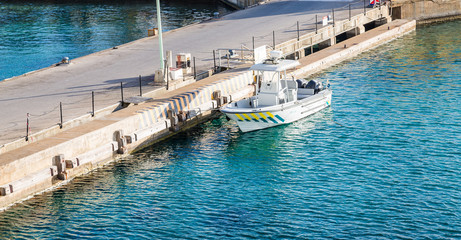 Small Coast Guard Cutter at Dock