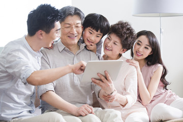 Happy family with digital tablet