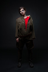 Sexy woman in military uniform. Studio shot. Black background