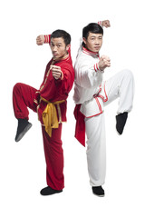 Focused Men Doing Martial Arts in Chinese Clothing