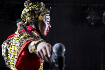 Fototapeta premium Man In Ceremonial Costume With Microphone