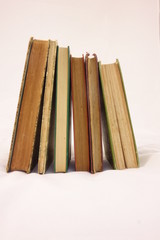 Old Books Upright on White Background