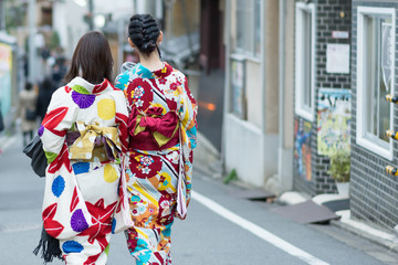 Obraz premium Back view of women in a kimono, Kyoto, Japan, selective focus, copy space