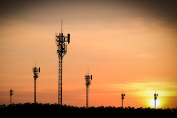 Silhouette phone antenna.Sunset background