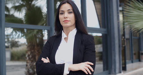 Confident serious young businesswoman