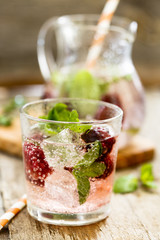 Cocktail with blackberry and fresh mint