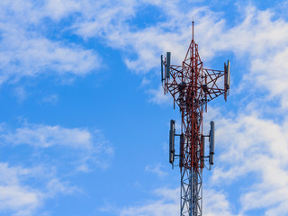 Close up white color antenna repeater tower on blue sky