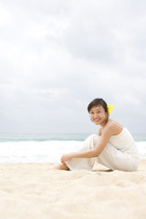 Fototapeta na wymiar Portrait of a young woman at the beach