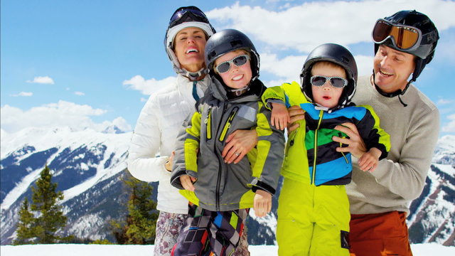 winter ski skiing vacation Caucasian family parents boys activity snow resort