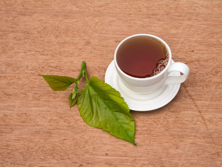 Cup of tea mulberry on vintage wooden background