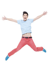 Happy young man jumping