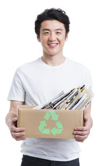 Young man recycling books